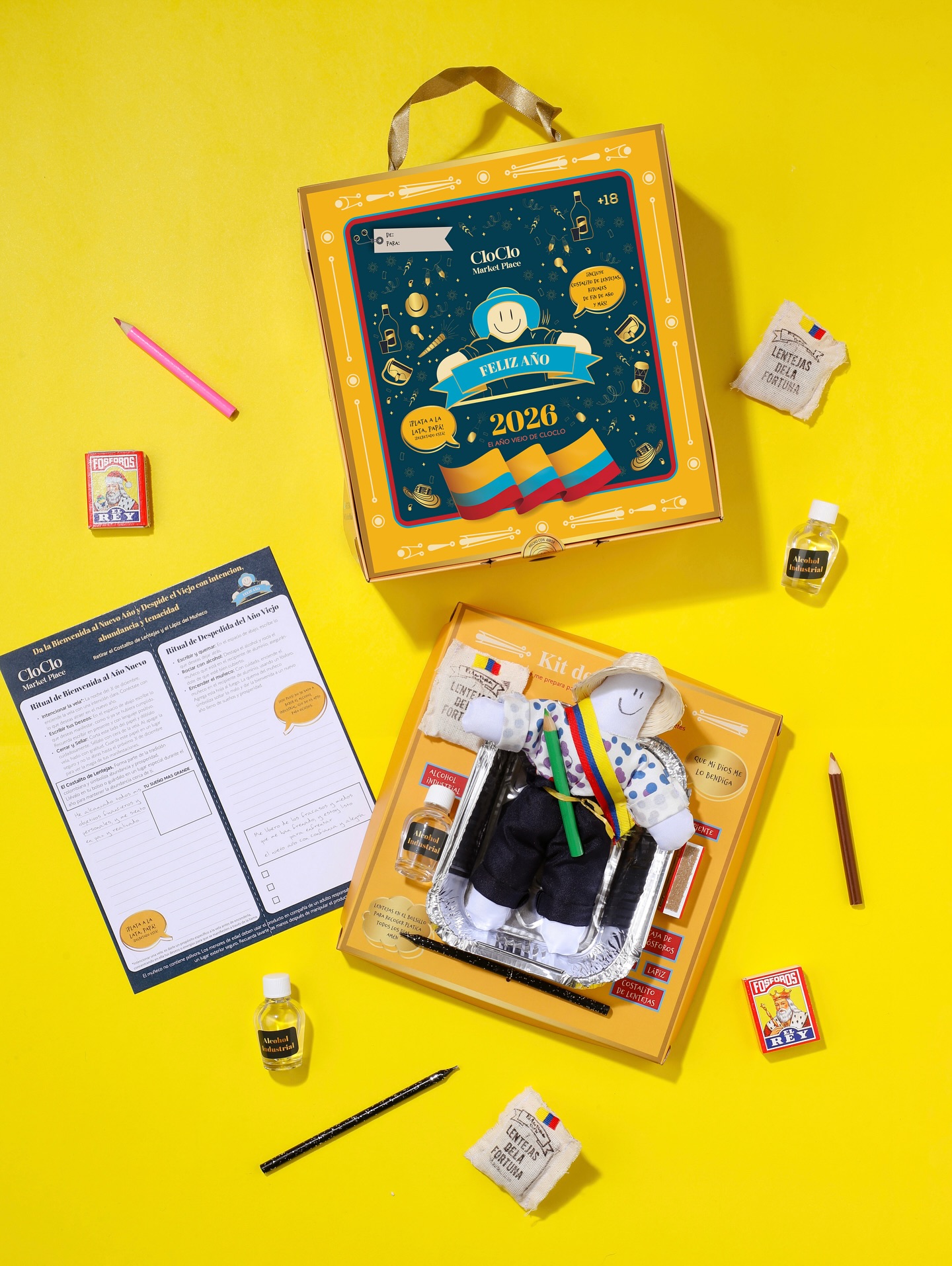 Elementos rituales del Kit de Año Viejo de CloClo Marketplace: carta de intención, costalito de lentejas, fósforos y objetos simbólicos hechos a mano para el ritual colombiano de diciembre.